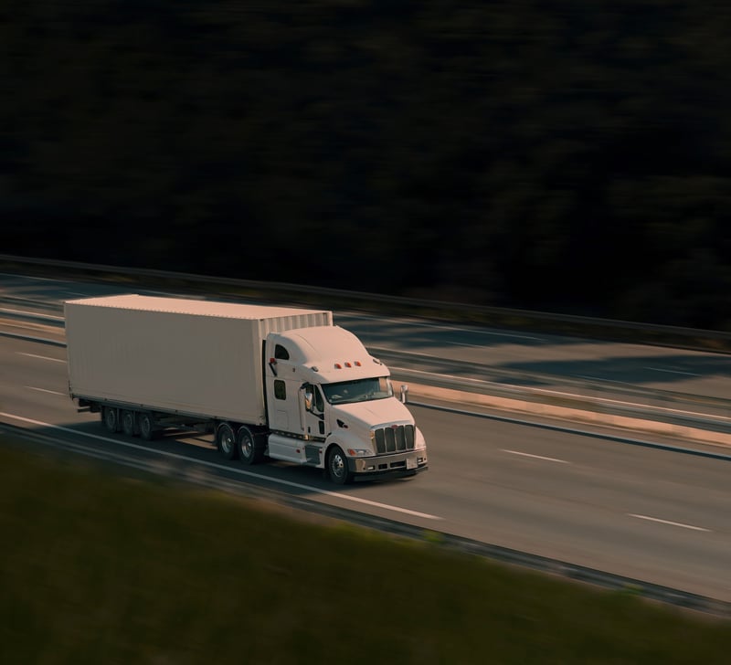 White truck driving on the road